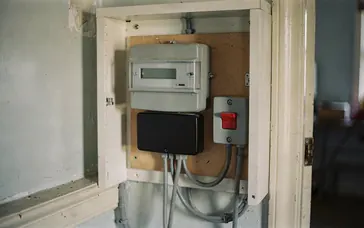 A business electricity meter in a meter cupboard